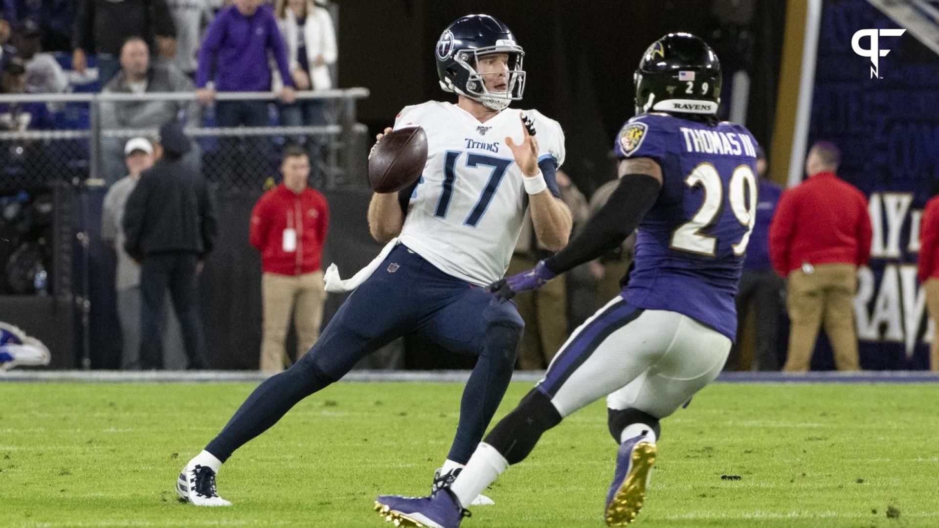 Tennessee Titans quarterback Ryan Tannehill (17) throws as Baltimore Ravens free safety Earl Thomas (29) defends.