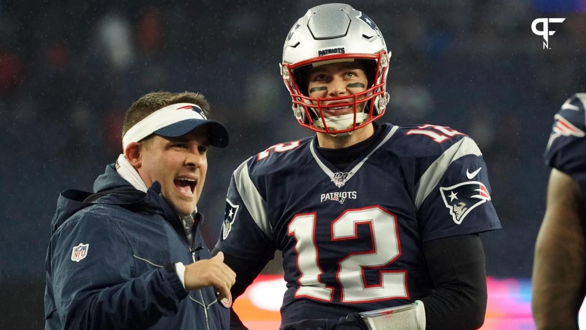 New England Patriots quarterback Tom Brady (12) talks with offensive coordinator Josh McDaniels before the start of the game against the Dallas Cowboys.