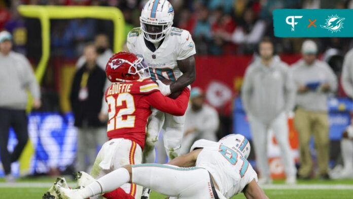 Kansas City Chiefs cornerback Trent McDuffie (22) forces a fumble by Miami Dolphins wide receiver Tyreek Hill (10) in the second quarter during an NFL International Series game at Deutsche Bank Park.