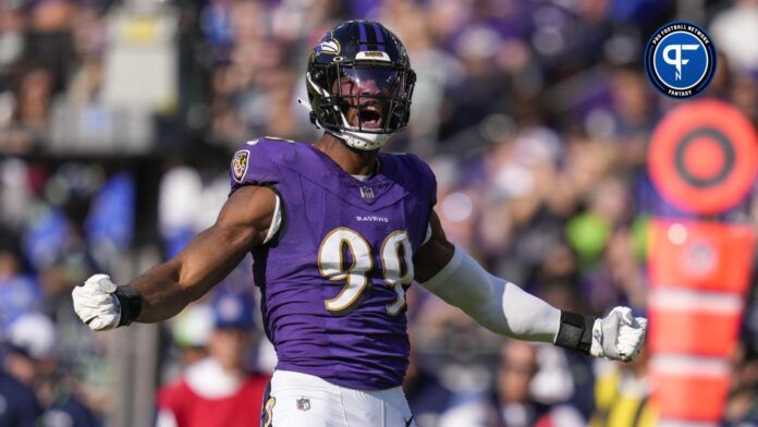 Odafe Oweh (99) celebrates after making a defensive play against the Seattle Seahawks during the first half at M&T Bank Stadium.