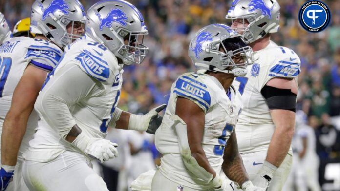 David Montgomery (5) celebrates scoring a touchdown in the fourth quarter against the Green Bay Packers.