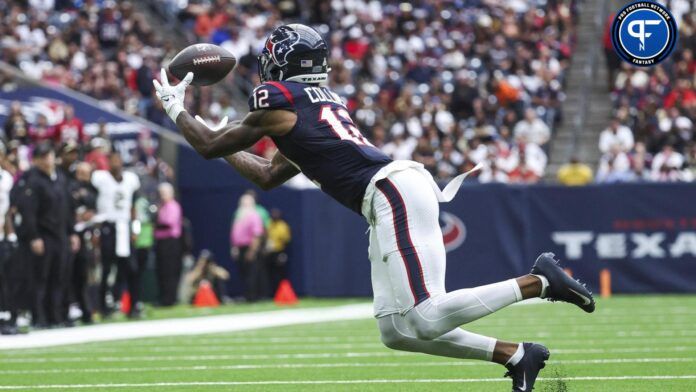 Nico Collins (12) makes a reception during the second quarter against the New Orleans Saints at NRG Stadium.