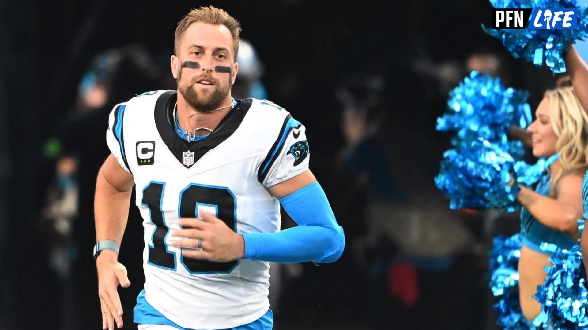 Carolina Panthers wide receiver Adam Thielen (19) runs on to the field before the game at Bank of America Stadium.