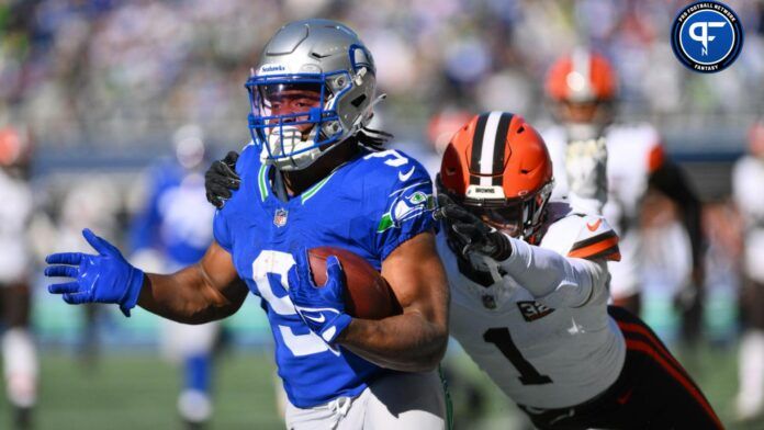 Seattle Seahawks running back Kenneth Walker III (9) carries the ball while Cleveland Browns safety Juan Thornhill (1) chases during the first half at Lumen Field.