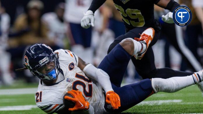 Chicago Bears running back D'Onta Foreman (21) is tackled by New Orleans Saints cornerback Paulson Adebo (29) during the second half at the Caesars Superdome.