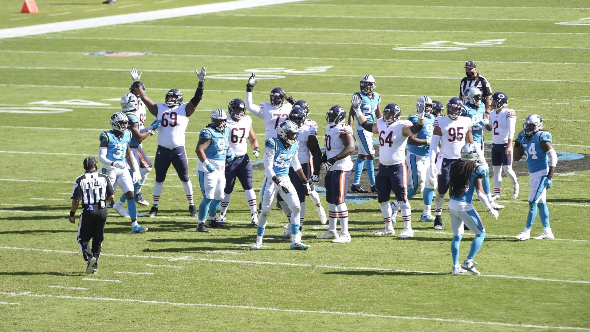 Chicago Bears players signal for a made field goal at the end of the second quarter at Bank of America Stadium.