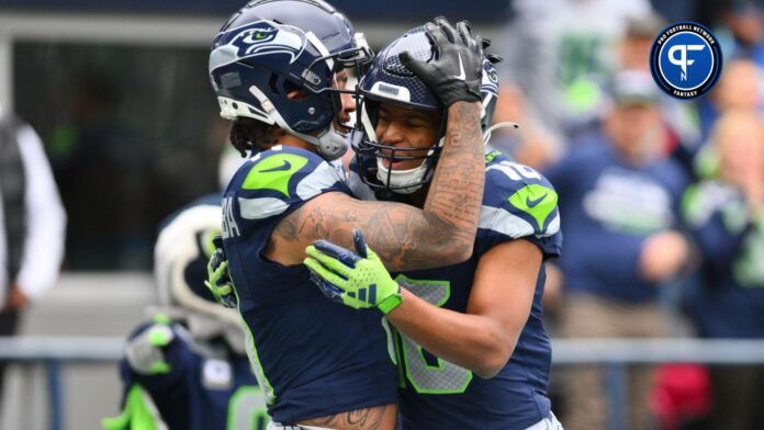 Seattle Seahawks wide receivers Tyler Lockett (16) and Jaxon Smith-Njigba (11) celebrate a touchdown.