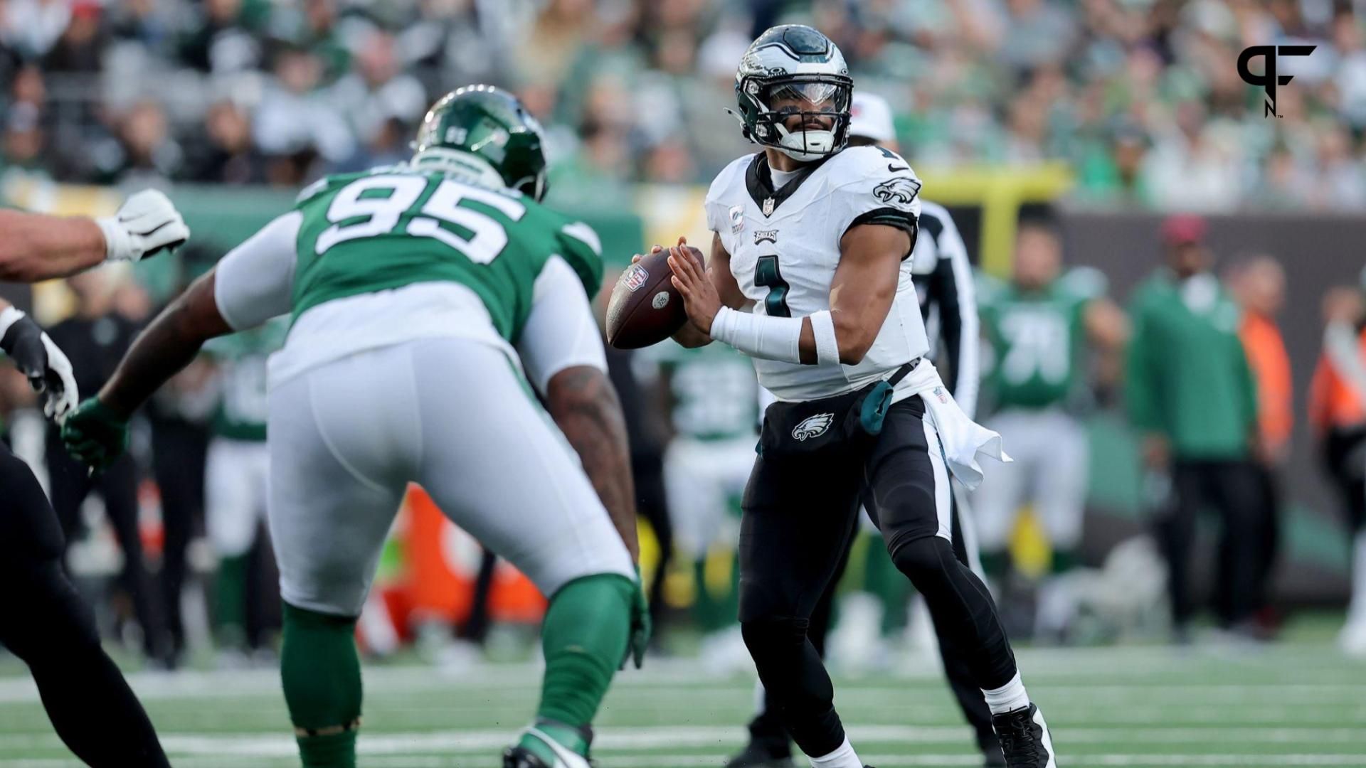 Philadelphia Eagles quarterback Jalen Hurts (1) looks to pass against New York Jets defensive tackle Quinnen Williams (95) during the first quarter.