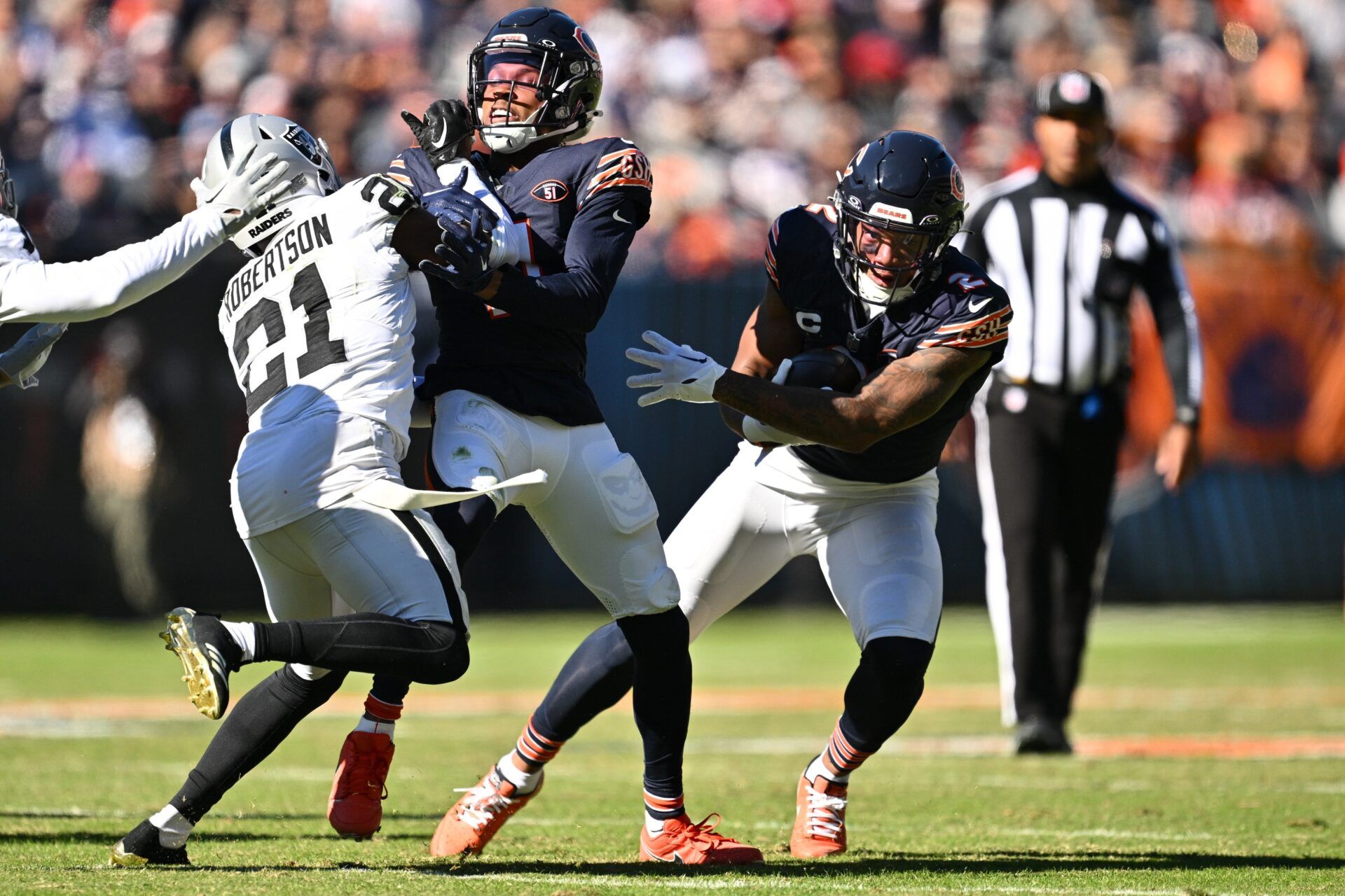 Chicago Bears WR DJ Moore (2) gets a block from WR Darnell Mooney (11) against the Las Vegas Raiders.