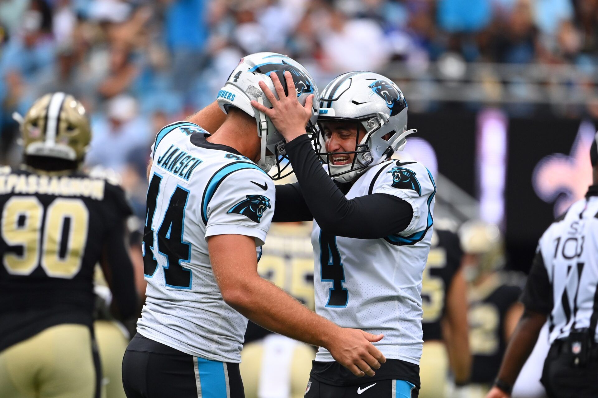 Carolina Panthers place kicker Eddy Pineiro (4) reacts with long snapper JJ Jansen (44) after kicking a field goal in the second quarter at Bank of America Stadium.