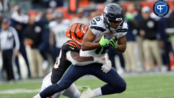 Seattle Seahawks wide receiver Tyler Lockett (16) makes the catch as Cincinnati Bengals safety Nick Scott (33) defends during the fourth quarter at Paycor Stadium.