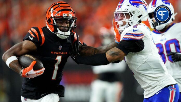 Cincinnati Bengals WR Ja'Marr Chase (1) tries to break a tackle against the Buffalo Bills.