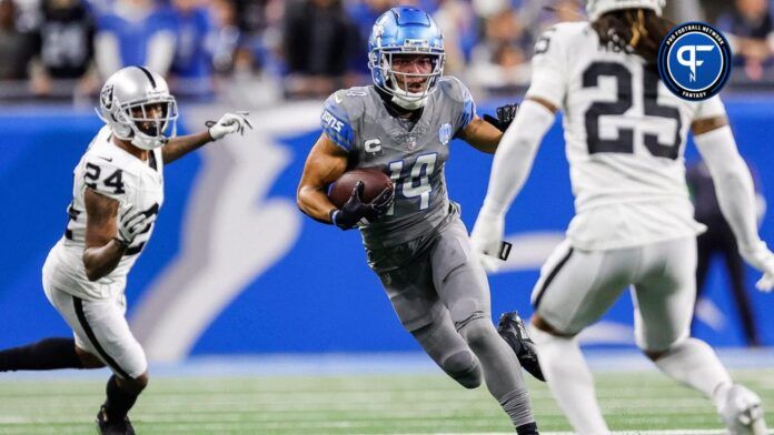 Lions wide receiver Amon-Ra St. Brown runs against Raiders safety Tre'von Moehrig during the first half at Ford Field on Monday, Oct. 30, 2023.