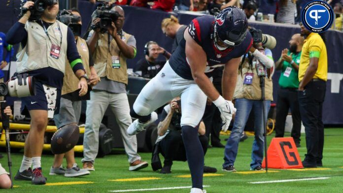 Houston Texans tight end Dalton Schultz (86) spikes the ball after scoring a touchdown against the Tampa Bay Buccaneers in the fourth quarter at NRG Stadium.