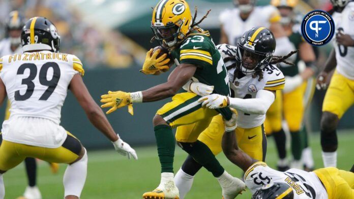 Green Bay Packers RB Aaron Jones (33) tries to break free against the Pittsburgh Steelers.