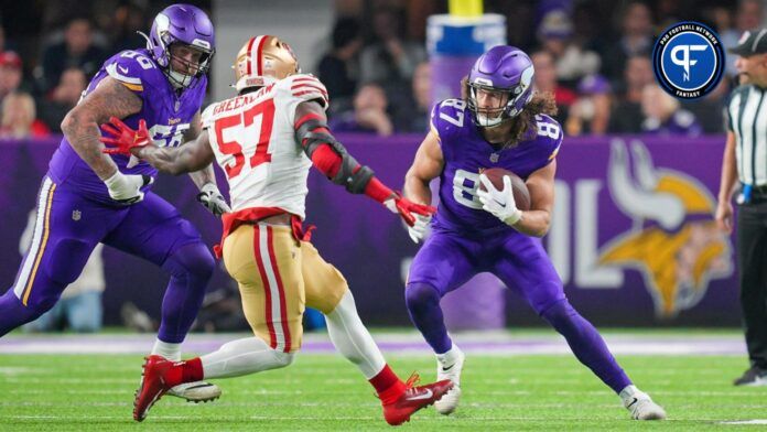 Minnesota Vikings tight end T.J. Hockenson (87) runs after the catch against the San Francisco 49ers linebacker Dre Greenlaw (57) in the second quarter at U.S. Bank Stadium.