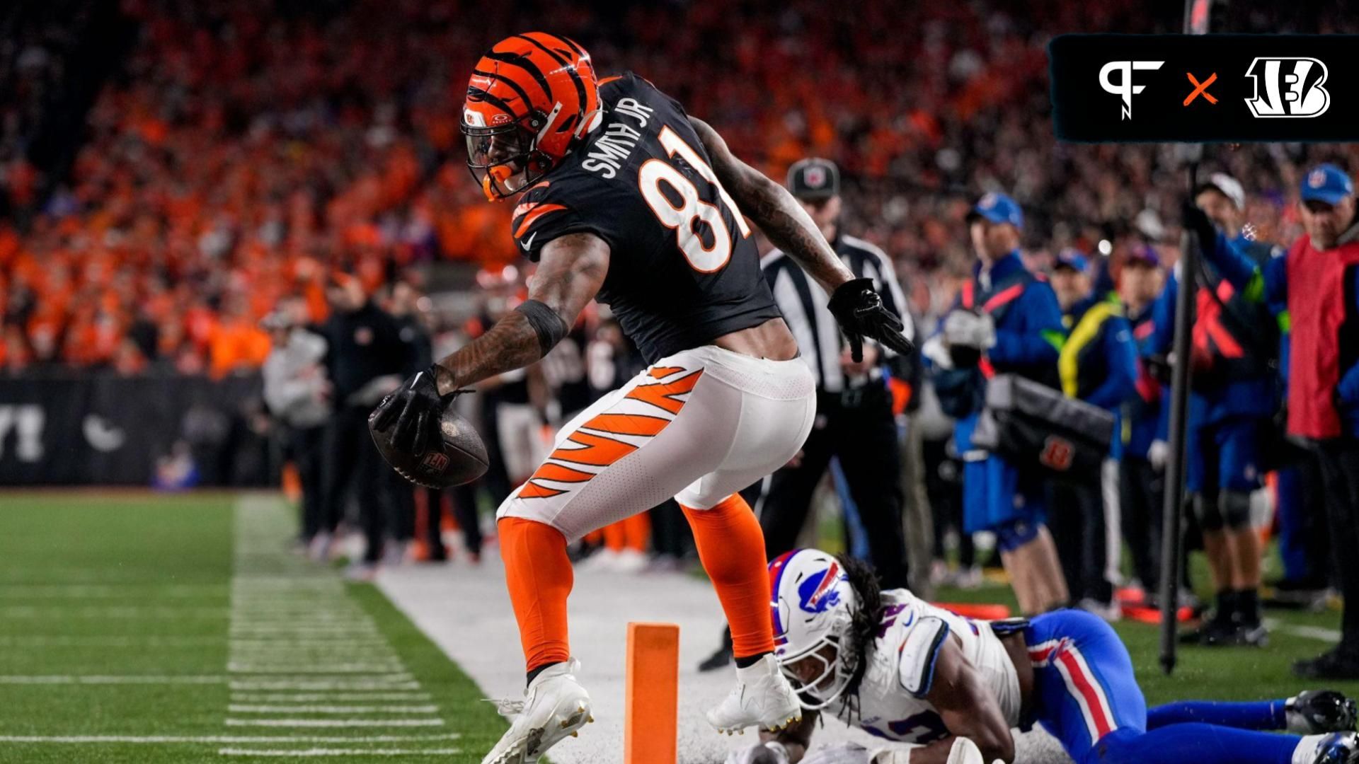 Cincinnati Bengals tight end Irv Smith Jr. (81) stretches to break the plane as he is knocked out of bounds by Buffalo Bills linebacker Dorian Williams (42) short of a touchdown in the fourth quarter of the NFL Week 9 game between the Cincinnati Bengals and the Buffalo Bills at Paycor Stadium.