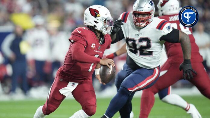 Arizona Cardinals quarterback Kyler Murray (1) scrambles away from New England Patriots defensive tackle Davon Godchaux (92) during the first quarter at State Farm Stadium.