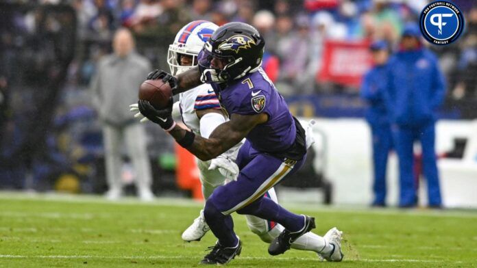 Rashod Bateman (7) catches a pass as Buffalo Bills safety Damar Hamlin (3) defends during the second quarter at M&T Bank Stadium.