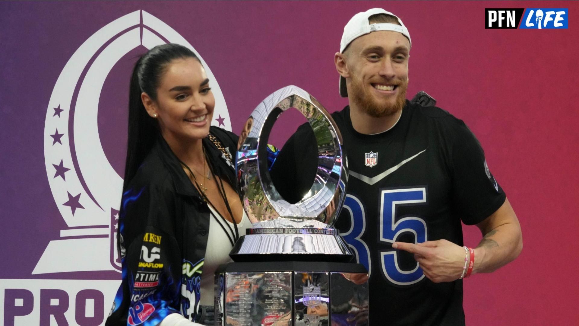 NFC tight end George Kittle of the San Francisco 49ers (85) and wife Claire Kittle pose with trophy during the Pro Bowl Games at Allegiant Stadium.