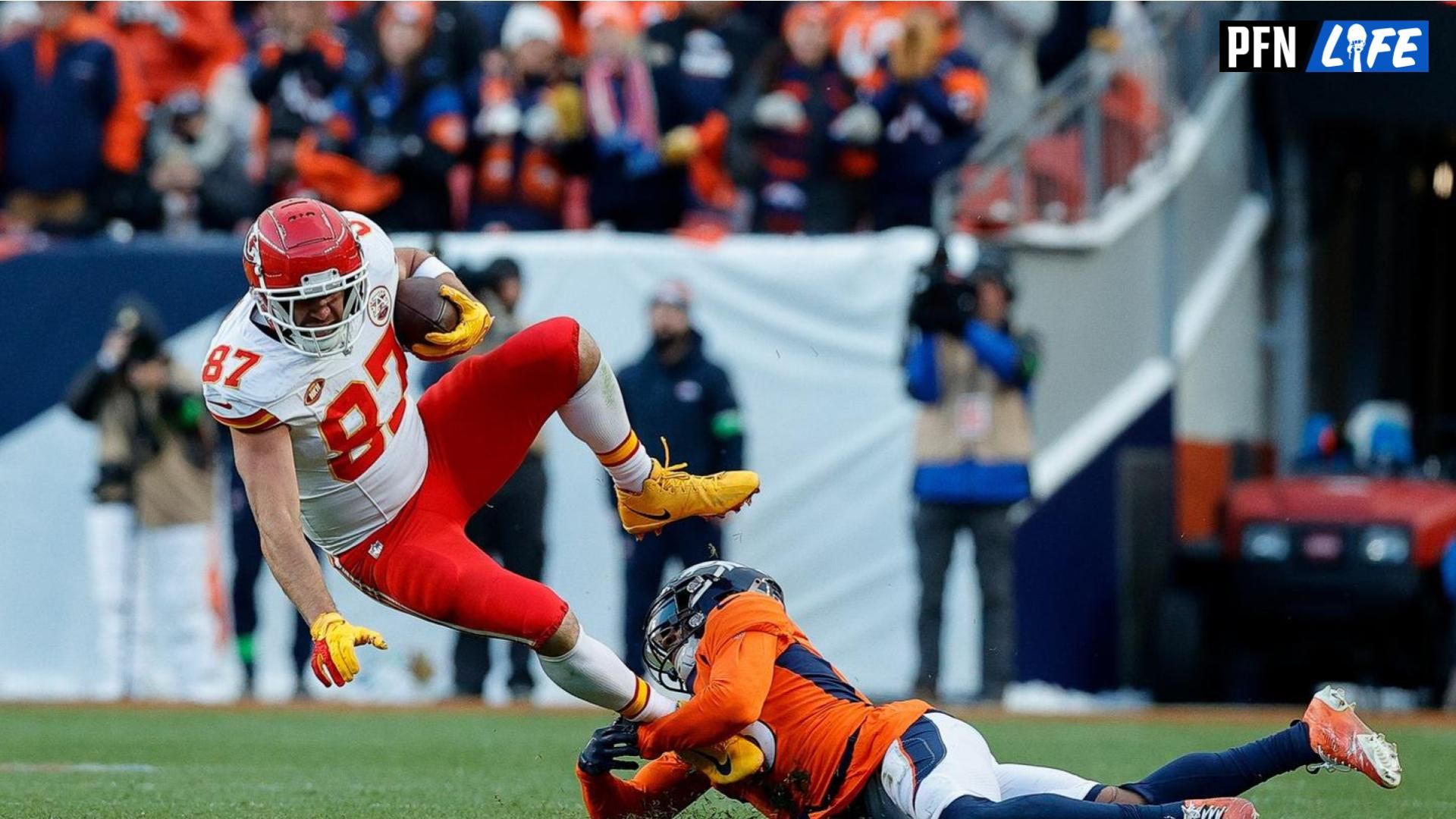 Kansas City Chiefs tight end Travis Kelce (87) is tackled by Denver Broncos safety P.J. Locke (6).