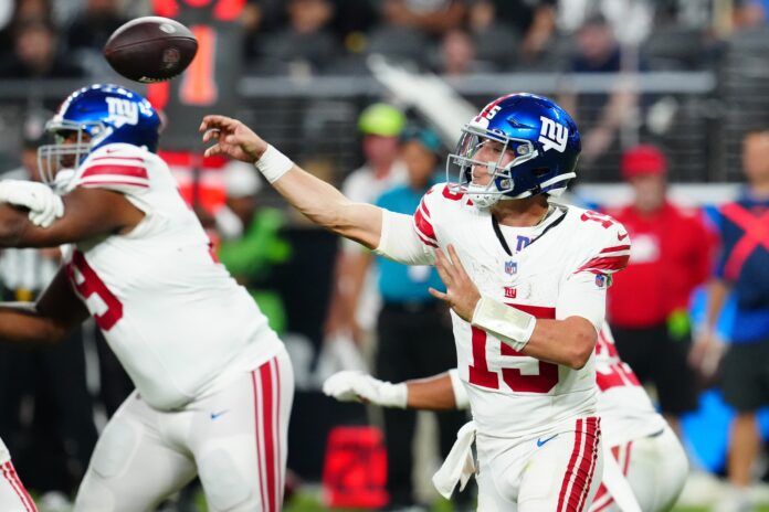 New York Giants quarterback Tommy DeVito (15) throws against the Las Vegas Raiders.