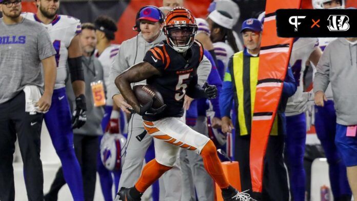 Tee Higgins (5) runs with the ball against the Buffalo Bills in the first half at Paycor Stadium.