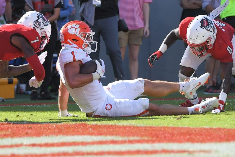 Will Shipley (1) is hit by North Carolina State Wolfpack cornerback Shyheim Battle (7) near the goal line during the second quarter at Carter-Finley Stadium.