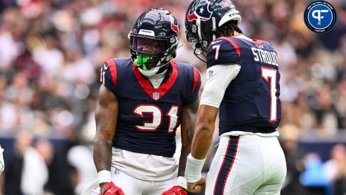 Dameon Pierce (31) and quarterback C.J. Stroud (7) react during the first quarter against the New Orleans Saints at NRG Stadium.