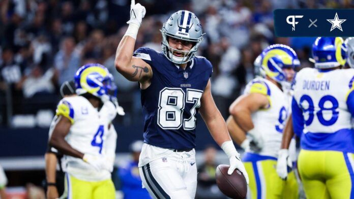 Ferguson (87) celebrates after catching a touchdown pass during the first quarter against the Los Angeles Rams at AT&T Stadium.