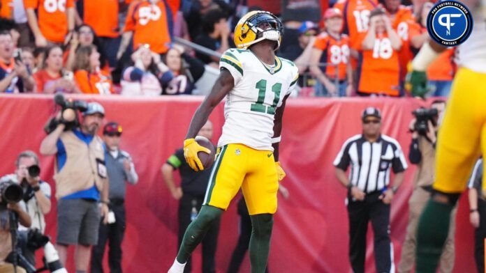 Jayden Reed (11) celebrates a touchdown reception in the second half against the Denver Broncos at Empower Field at Mile High.