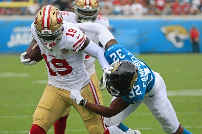 Jacksonville Jaguars cornerback Tyson Campbell (32) manages to shove San Francisco 49ers wide receiver Deebo Samuel (19) out of bounds during the first quarter at TIAA Bank Field Sunday, Nov. 21, 2021 in Jacksonville. The Jacksonville Jaguars hosted the San Francisco 49ers during a regular season NFL game.