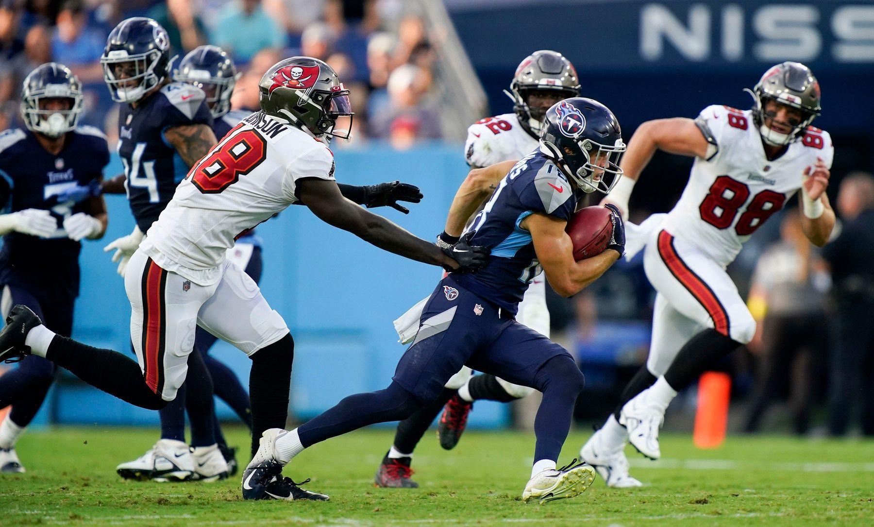 Tennessee Titans wide receiver Kyle Philips (18) races up the field with a punt return during the first quarter of a preseason game against the Tampa Bay Buccaneers at Nissan Stadium Saturday, Aug. 20, 2022, in Nashville, Tenn.
