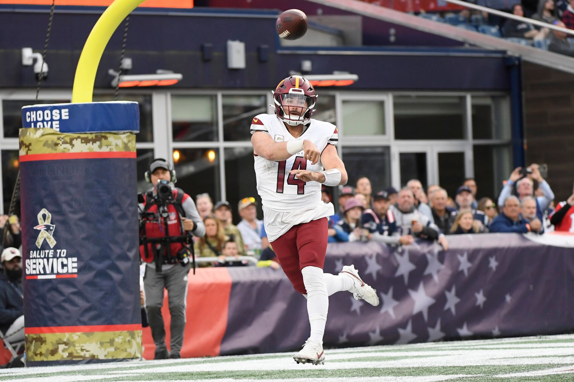 Washington Commanders quarterback Sam Howell (14) throws the ball during the second half against the New England Patriots at Gillette Stadium.