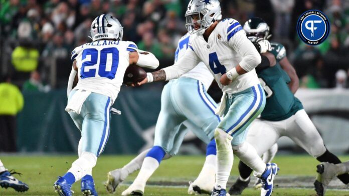 Dallas Cowboys quarterback Dak Prescott (4) hands off to running back Tony Pollard (20) against the Philadelphia Eagles at Lincoln Financial Field.