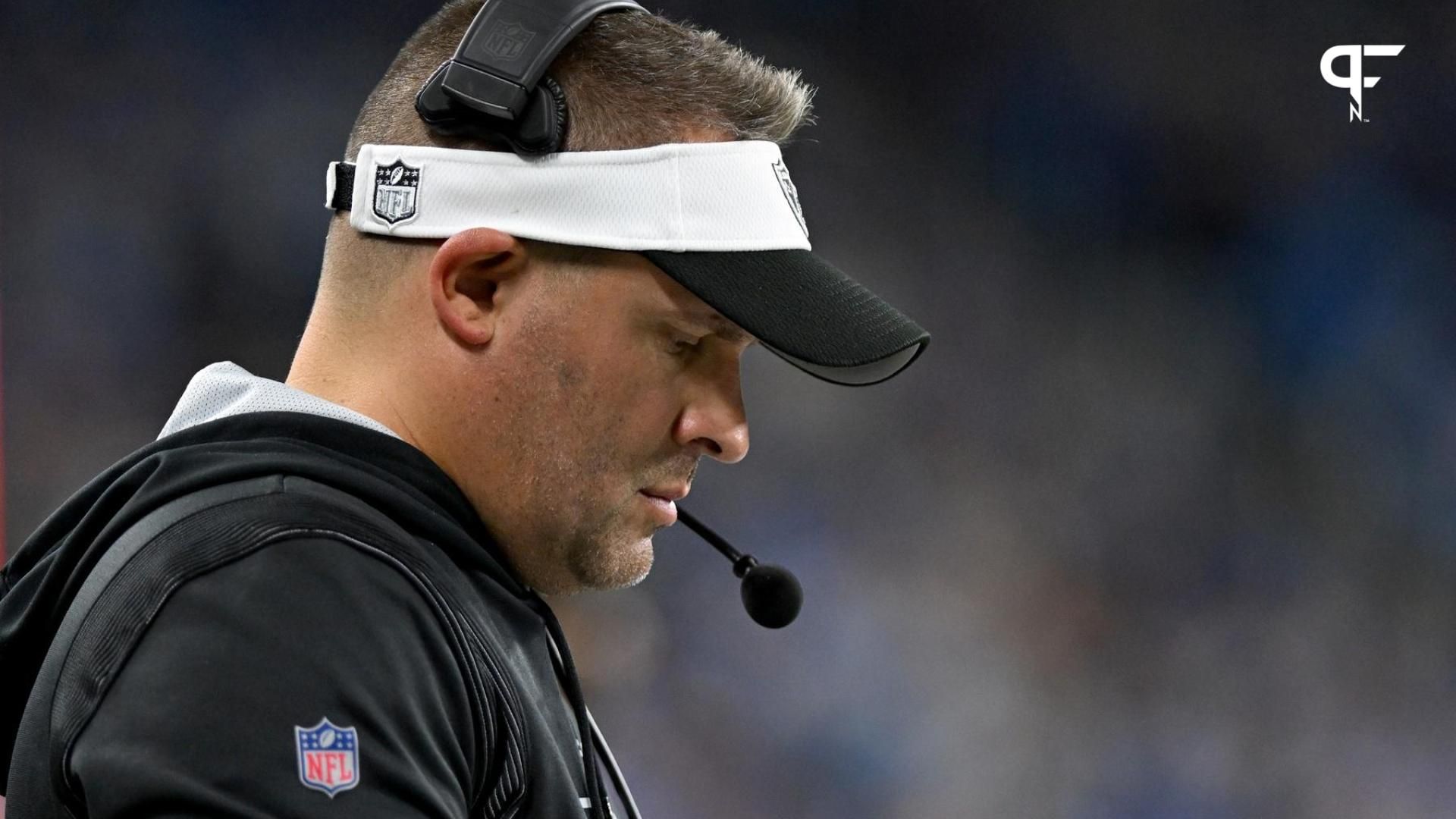 Las Vegas Raiders head coach Josh McDaniels checks his play sheet on the sidelines during the fourth quarter of their game against the Detroit Lions at Ford Field.