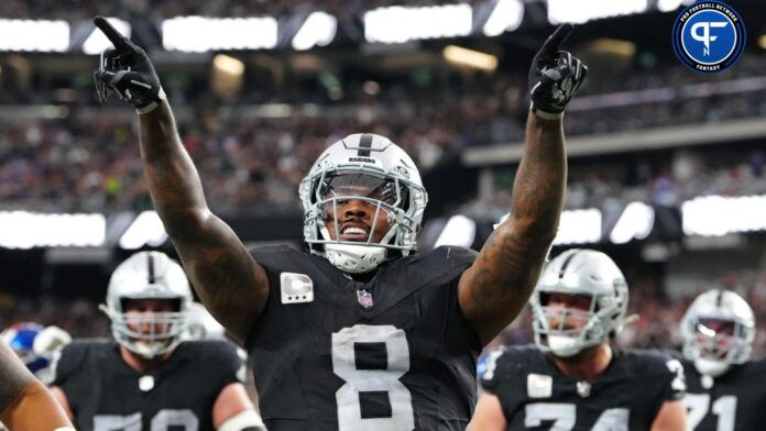 Josh Jacobs (8) celebrates after scoring a touchdown against the New York Giants during the second quarter at Allegiant Stadium.