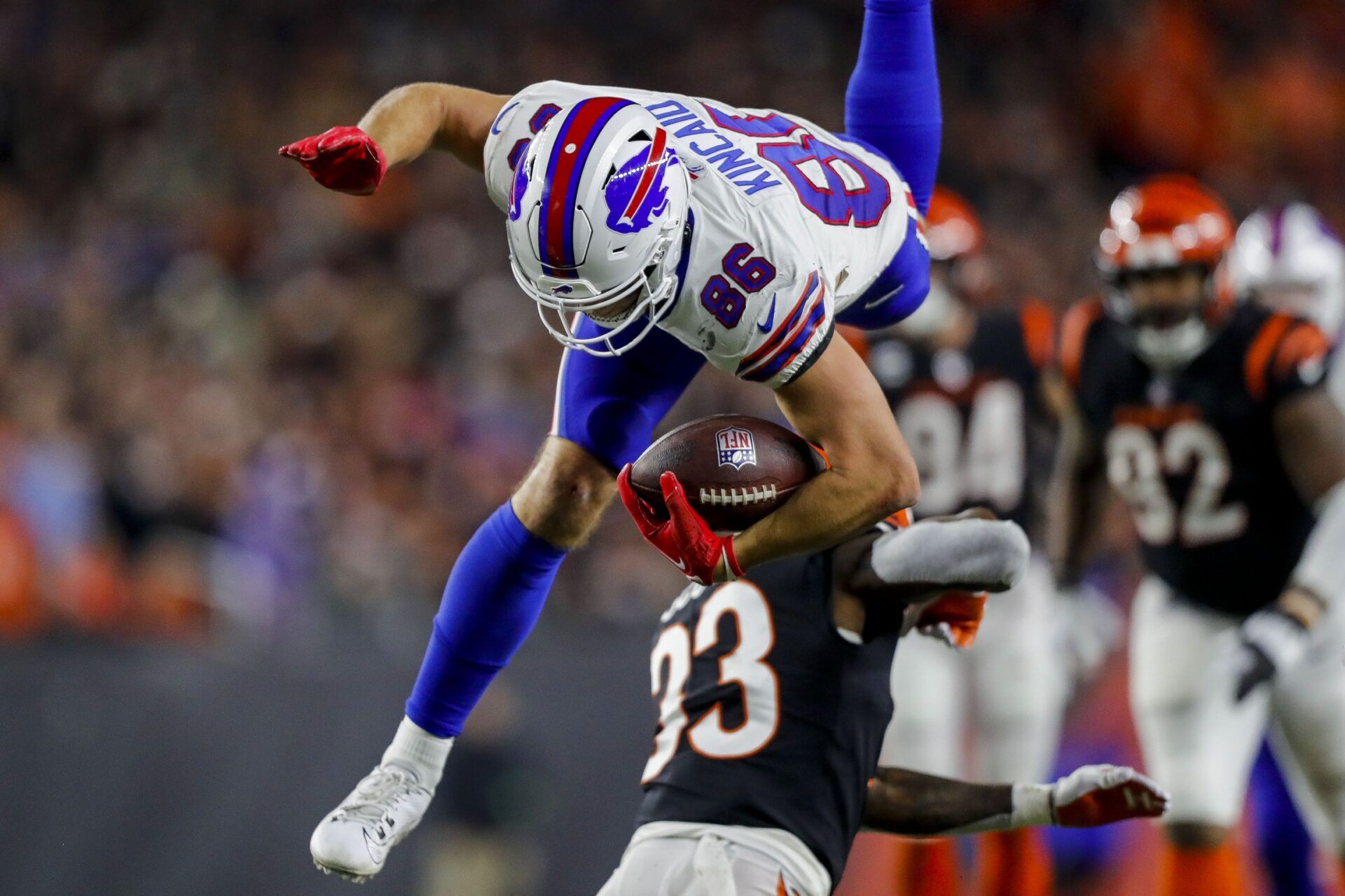Buffalo Bills tight end Dalton Kincaid (86) leaps over Cincinnati Bengals safety Nick Scott (33) in the second half at Paycor Stadium.