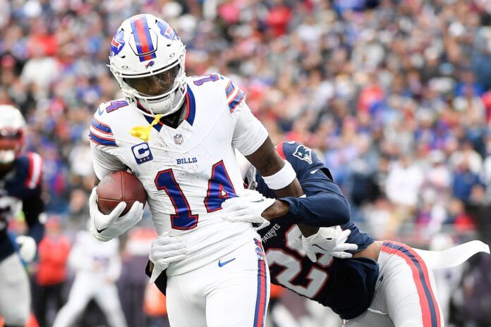 Stefon Diggs (14) breaks the tackle of New England Patriots cornerback J.C. Jackson (29) during the second half at Gillette Stadium.