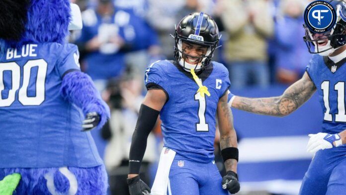 Josh Downs (1) is congratulated after scoring a touchdown Sunday, Oct. 22, 2023, during a game against the Cleveland Browns at Lucas Oil Stadium.