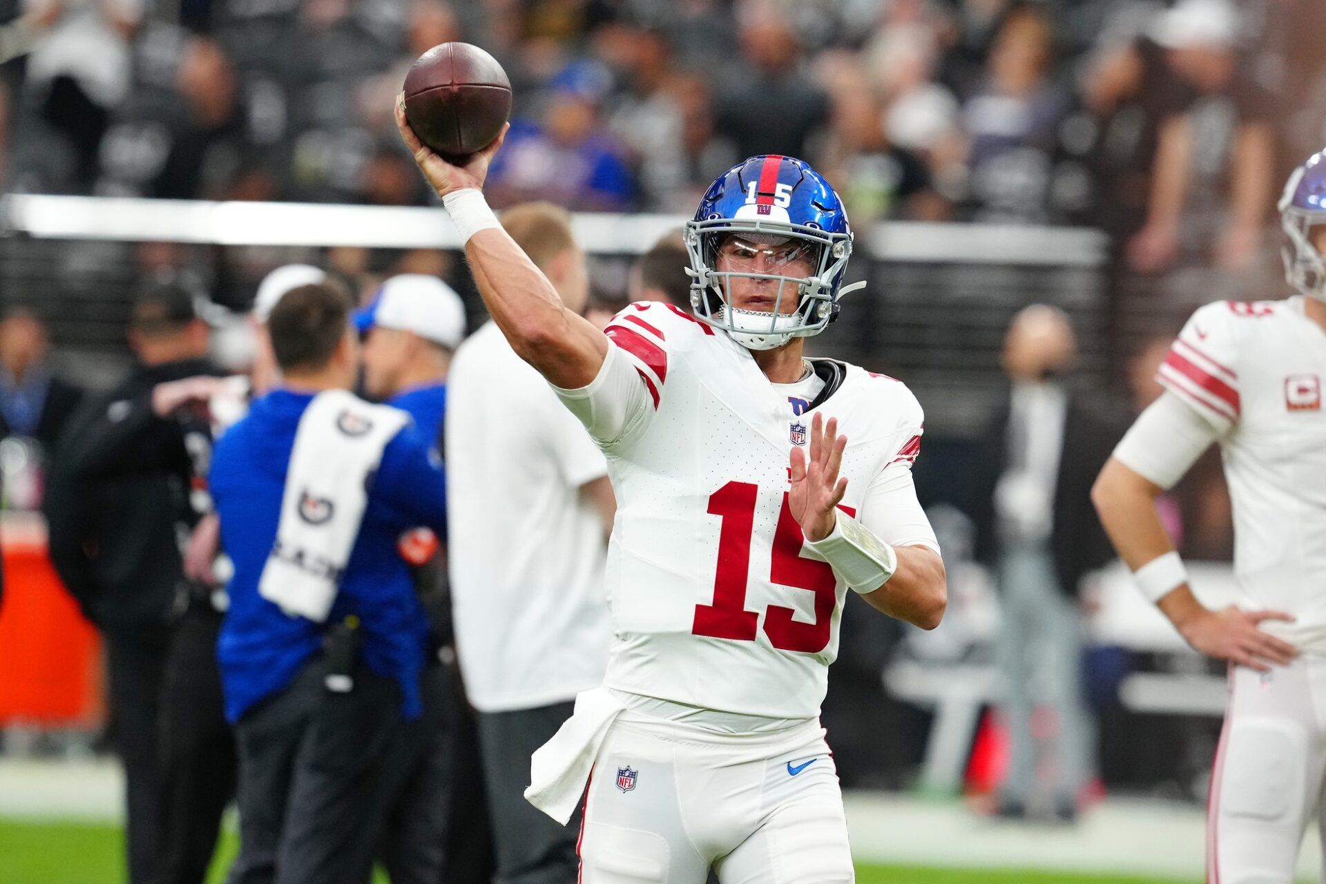 New York Giants quarterback Tommy DeVito (15) warms up before a game against the Las Vegas Raiders at Allegiant Stadium.