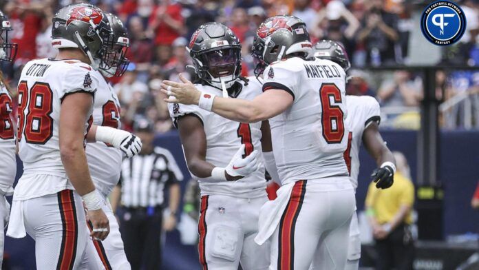 Rachaad White (1) and quarterback Baker Mayfield (6) celebrate after a touchdown during the second quarter against the Houston Texans at NRG Stadium.