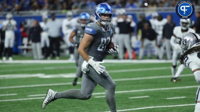 Sam LaPorta catches a touchdown pass against Raiders safety Tre'von Moehrig during the first half at Ford Field.