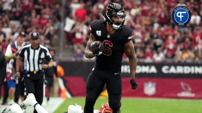 Arizona Cardinals running back James Conner (6) breaks past Cincinnati Bengals safety Nick Scott (33) at State Farm Stadium in Glendale on Oct. 8, 2023.