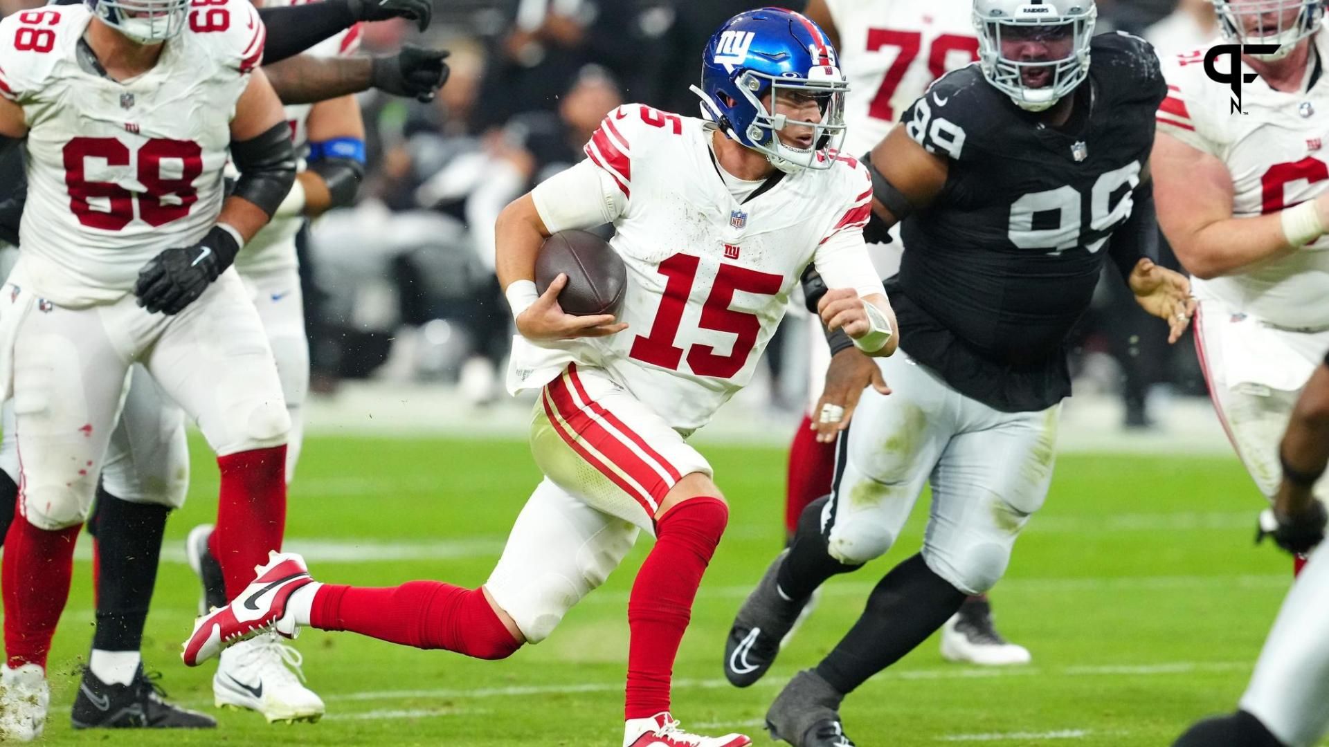 New York Giants QB Tommy DeVito (15) runs the ball against the Las Vegas Raiders.