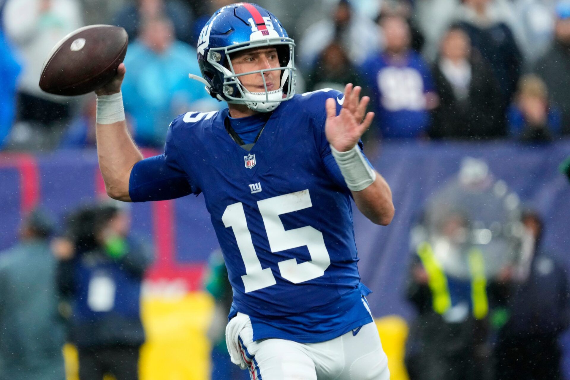 New York Giants QB Tommy DeVito (15) throws a pass against the Jets.