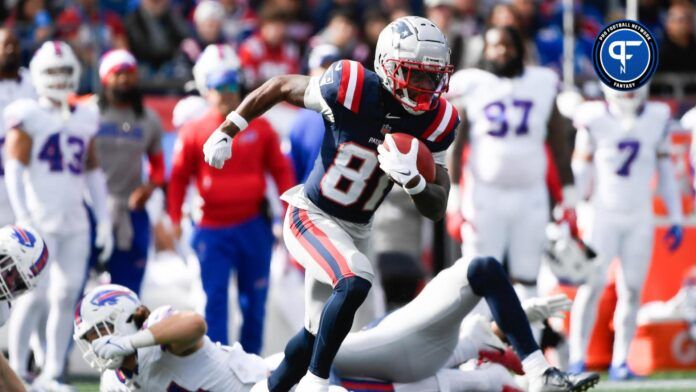 New England Patriots wide receiver Demario Douglas (81) runs with the ball during the first half against the Buffalo Bills at Gillette Stadium.