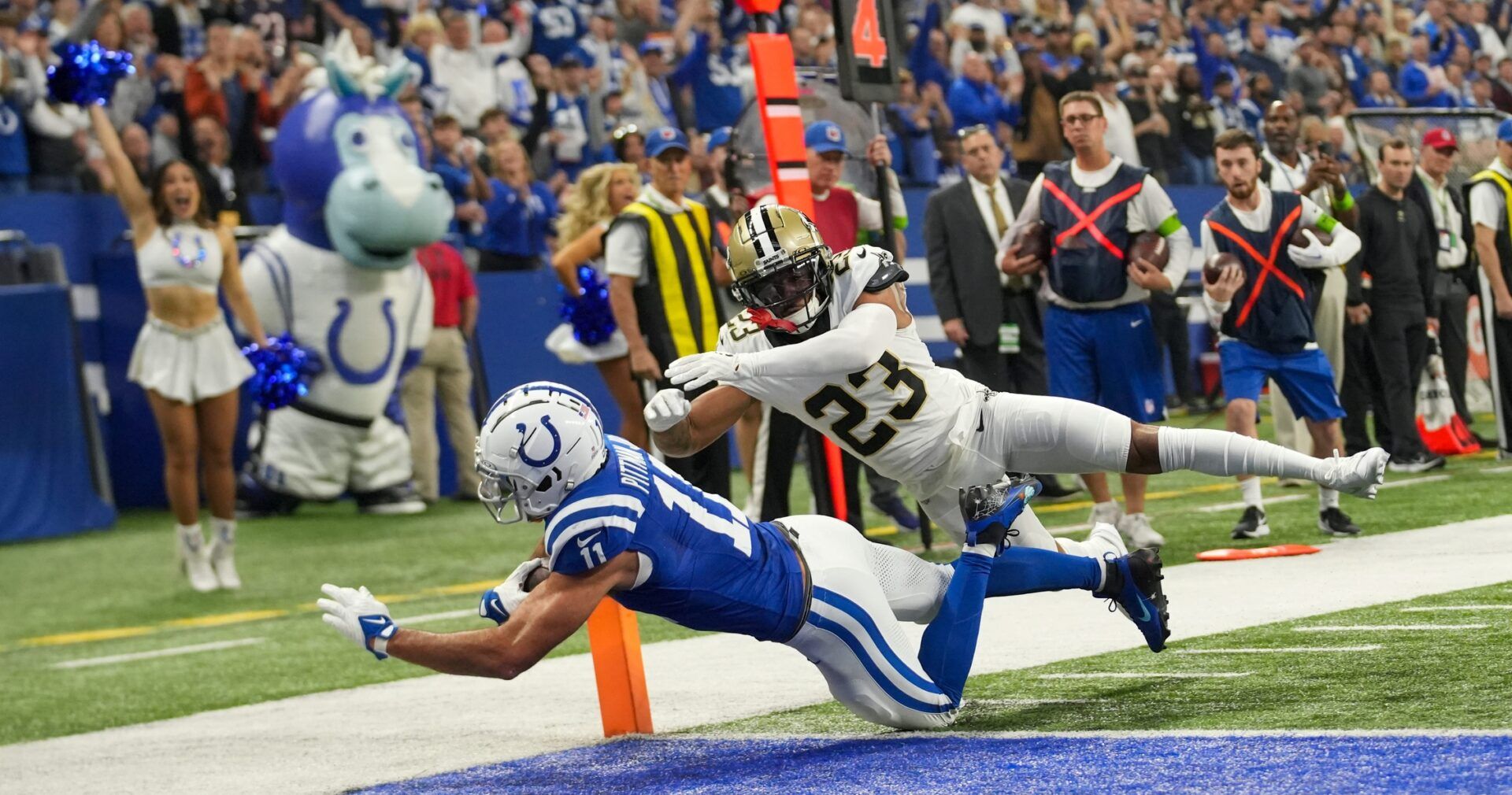 Michael Pittman Jr. (11) scores a first quarter touchdown as he is defended by New Orleans Saints cornerback Marshon Lattimore (23).