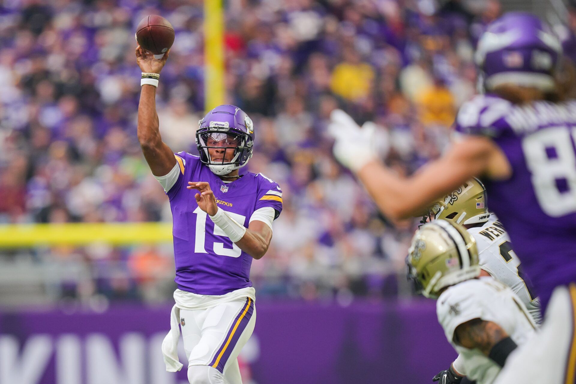 Joshua Dobbs (15) passes to tight end T.J. Hockenson (87) against the New Orleans Saints in the second quarter at U.S. Bank Stadium.