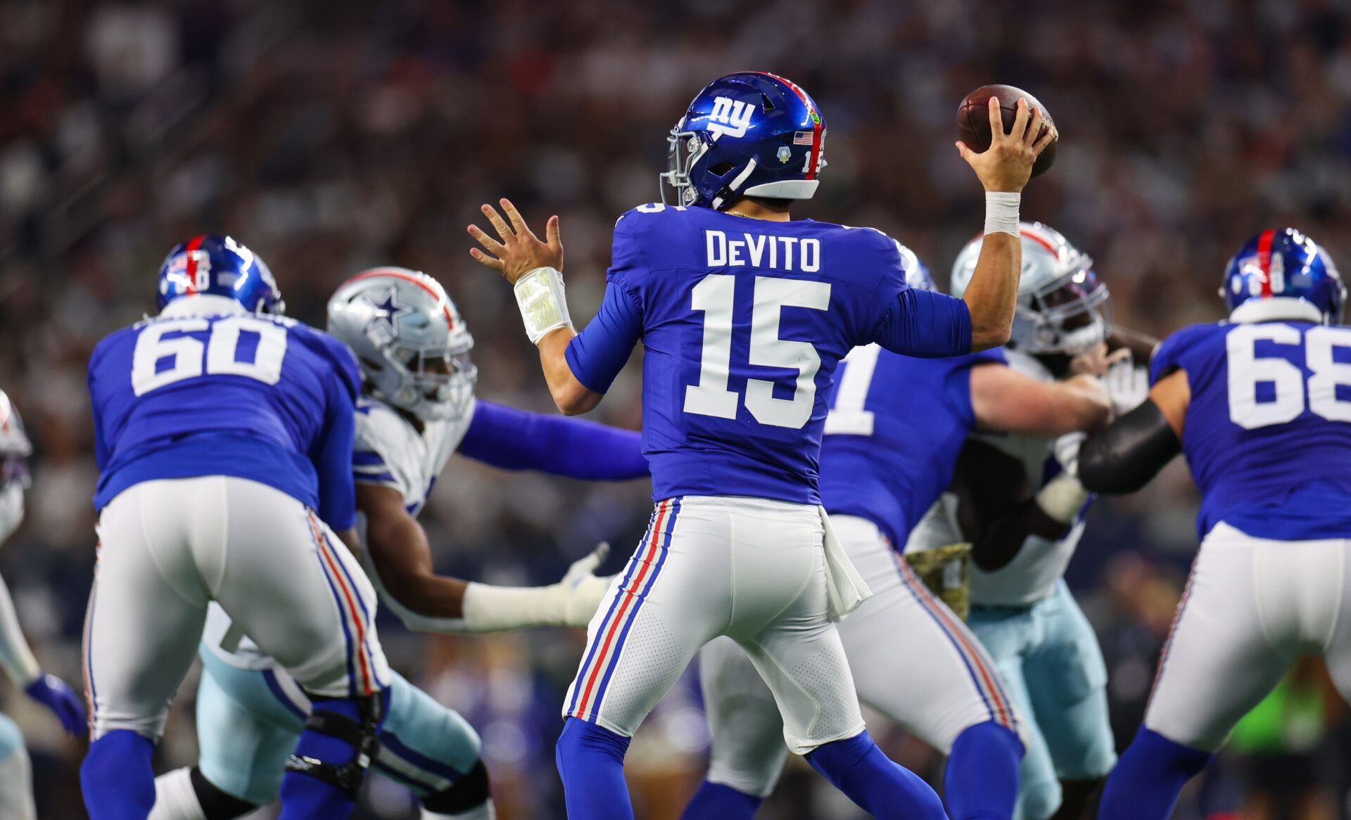 New York Giants QB Tommy DeVito (15) throws a pass against the Dallas Cowboys.